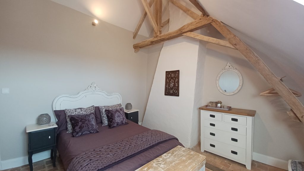 Cozy bedroom with exposed beams